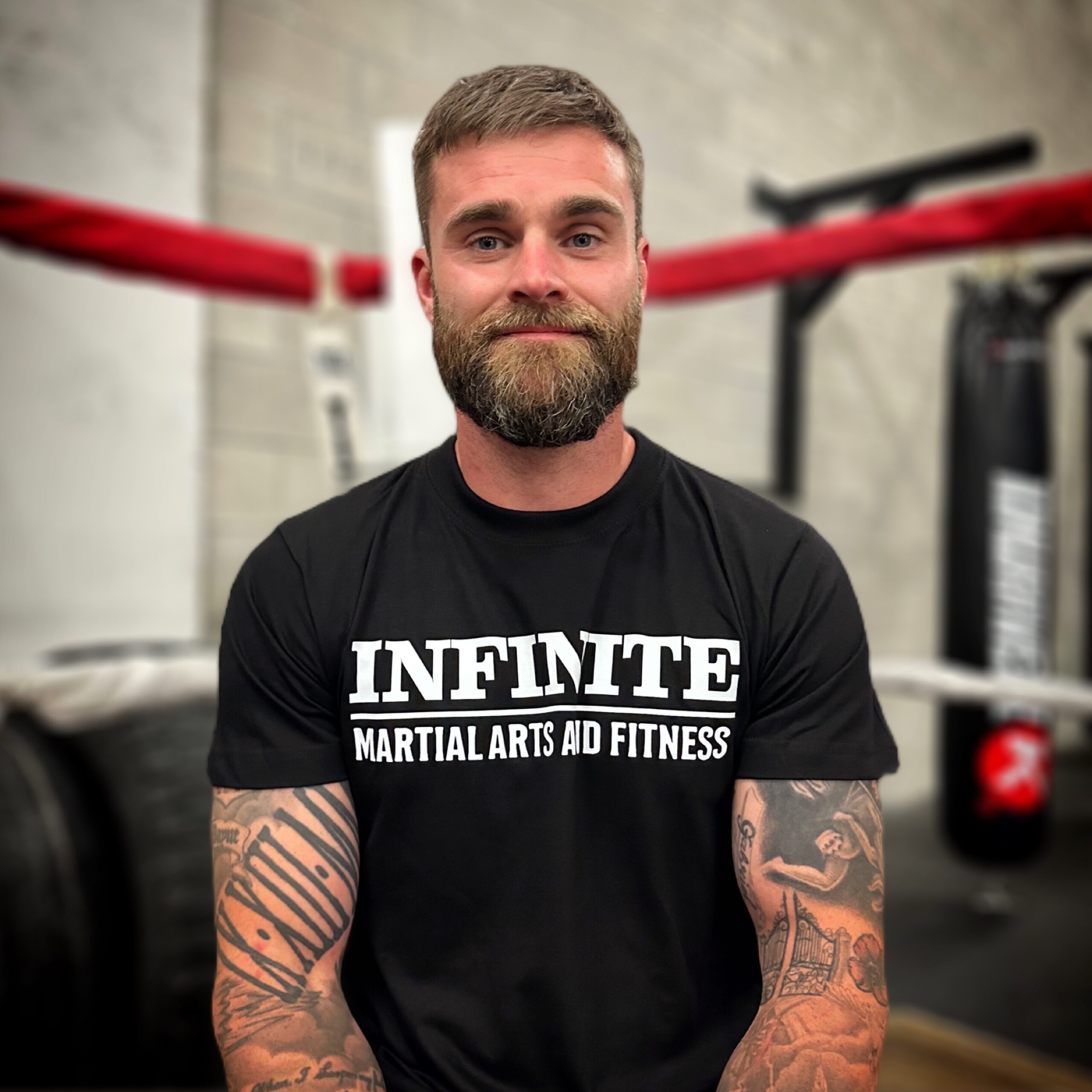 Christian Payne boxing instructor of Infinite martial arts sitting in the ring